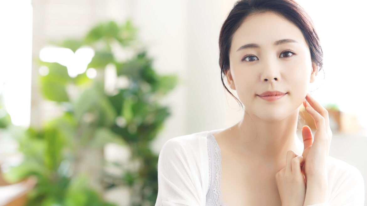 Beautiful Korean women showcasing her flawless skin, achieved by Korean skin care