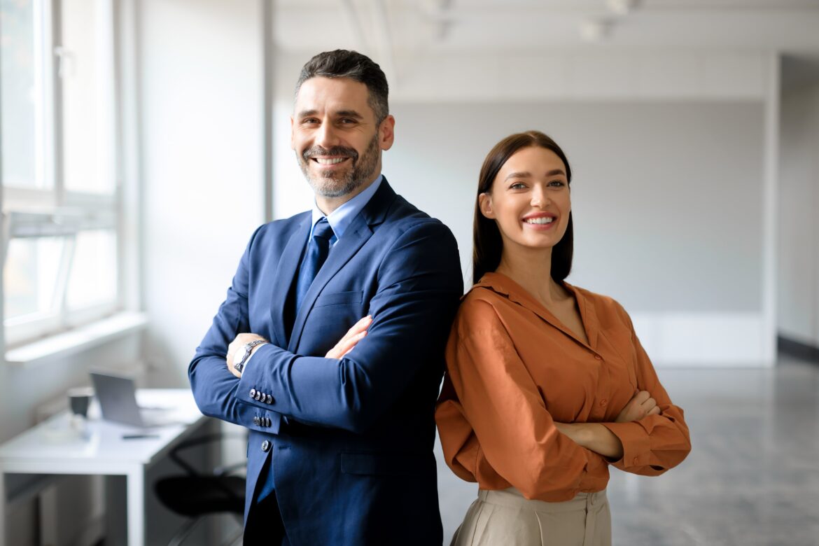 Businessman and businesswoman in professional outfits