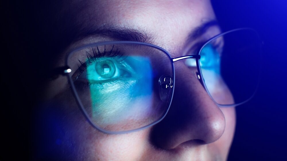 Girl works on internet. Reflection at the glasses from laptop.
Close up of woman's eyes with black female glasses for working at a computer. Eye protection from blue light and rays.